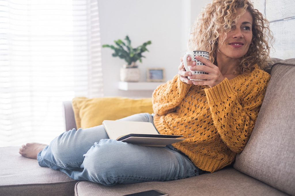 woman with healthy skin relaxing at home