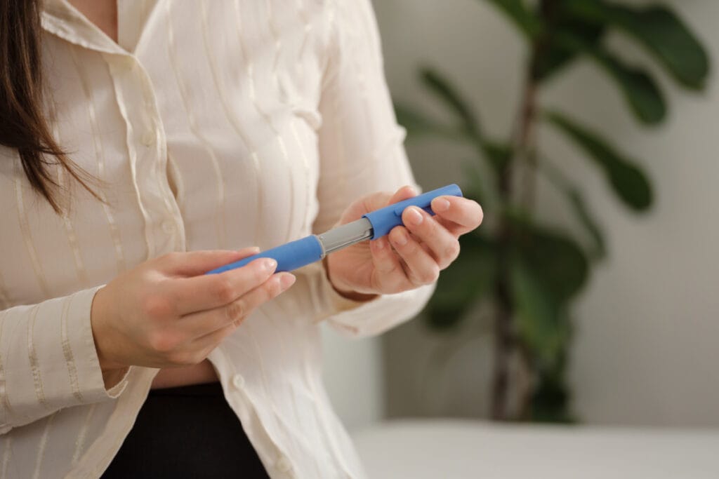 Woman opening a GLP-1 weight loss medication