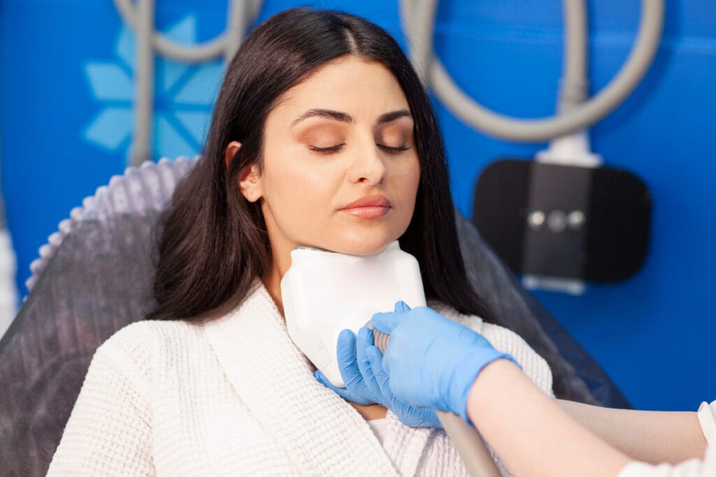 Woman getting CoolSculpting for chin fat removal